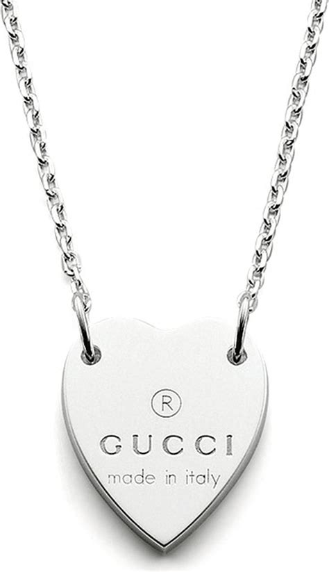 heart necklace with gucci trademark.